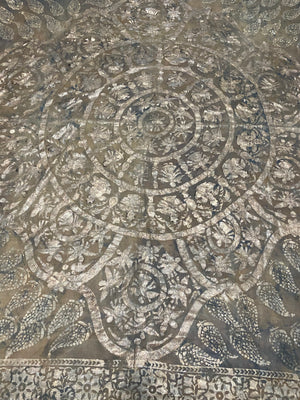 Pichwai temple hanging, silver leaf on a ground of handwoven cotton, featuring Krishna, gopis and apsaras. This devotional cloth hanging was made by Shri Nathji devotees of the Pushti Marg Sect. A large and rare circular-patterned example dating to late 19th Century and a collector's item. Measurements: 173 x 157 cm