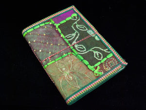 Eco-friendly sari cover journal notebooks are filled with creamy white, handmade recycled notebook paper and are covered in a patchwork of old cotton sari textiles, all finished with cotton, thread and sequin detailing. Three sizes