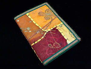 Eco-friendly sari cover journal notebooks are filled with creamy white, handmade recycled notebook paper and are covered in a patchwork of old cotton sari textiles, all finished with cotton, thread and sequin detailing. Three sizes