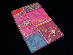 Eco-friendly sari cover journal notebooks are filled with creamy white, handmade recycled notebook paper and are covered in a patchwork of old cotton sari textiles, all finished with cotton, thread and sequin detailing. Three sizes