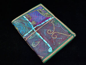 Eco-friendly sari cover journal notebooks are filled with creamy white, handmade recycled notebook paper and are covered in a patchwork of old cotton sari textiles, all finished with cotton, thread and sequin detailing. Three sizes