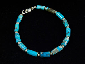 Turquoise bracelet of tube-cut, sky blue natural turquoise beads, with sterling silver detailing and clasp. Order in different sizes.