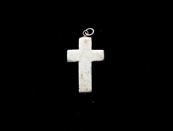 Howlite stone cross pendant, with sterling silver mount and ring bail, and a tiny silver ball detailing at the base of the cross. Thick cut and chunky in design, this would look great on a silver chain or a leather cord. Suitable as men's jewellery or women's jewellery.