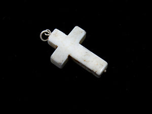 Howlite stone cross pendant, with sterling silver mount and ring bail, and a tiny silver ball detailing at the base of the cross. Thick cut and chunky in design, this would look great on a silver chain or a leather cord. Suitable as men's jewellery or women's jewellery.