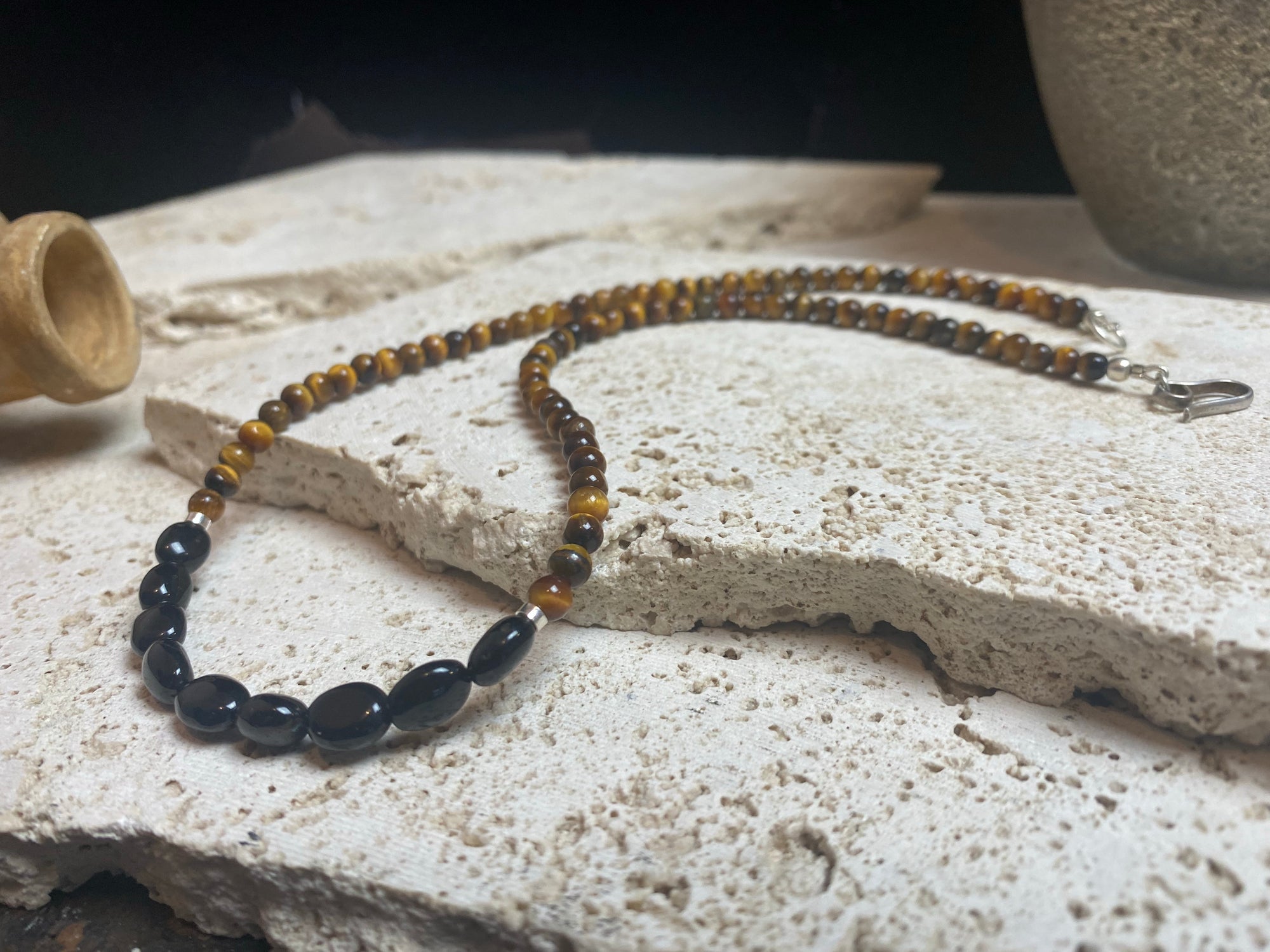 Earthy, rich and natural - our natural tigers eye necklace features pebble cut black agate and sterling silver detailing. This boho necklace is ethnic inspired chic. Length 46.5 cm