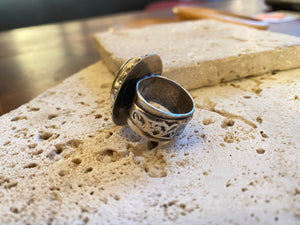 Afghan tribal ring features a large light coloured cabochon carnelian stone. The wide ring band features a stunning applied panel of work with a small crest panel for engraving. High grade silver. Late 19th century. Size 6.5