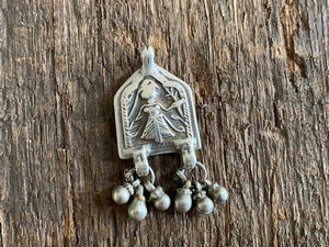 Antique silver amulets represent the Hindu goddess Kansari, goddess of the harvest and of fertility. These small pendants are traditionally worn for good luck, to increase fertility and to bring all good things to you and your home. These pendants date from the early 19th - early 20th century. Measurements: all vary between 1.4 and 1.8 cm in width