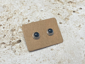 Simple and elegant, these small black onyx earring studs are hand made from sterling silver and set with onyx cabochons