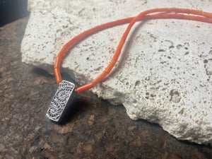 Orange-red coral necklace with sterling silver filigree pendant. Finished with l silver hook clasp. Length 45 cm