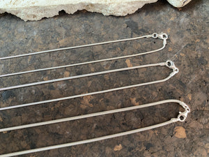 2.1 mm diameter snake chain in two lengths, these nickel-free chains are German-made from 93.5% silver and are tarnish-resistant. Our snake chain features a parrot clasp and is fitted with a narrow bail to ensure even the smallest of pendants will fit. Select Long 70 cm/28" or Very long - 80 cm/32"