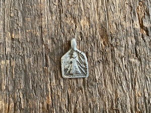 Antique silver amulets represent the Hindu goddess Kansari, goddess of the harvest and of fertility. These small pendants are traditionally worn for good luck, to increase fertility and to bring all good things to you and your home. These pendants date from the early 19th - early 20th century. Measurements: all vary between 1.4 and 1.8 cm in width