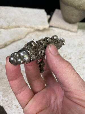 High grade, heavy silver amulet with fused ends, mid 19th century, from Afghanistan. Length 8.5 cm