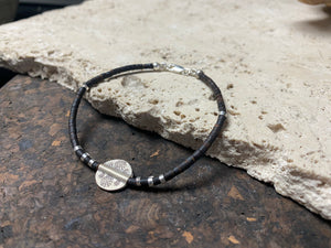 One of our signature coconut silver bracelets, crafted from polished coconut wood and hill tribe 95% silver., with sterling silver lobster clasp. A women's bracelet or a men's bracelet, it has a casual Boho vibe, and is made for that stacked bracelet look. Different sizes available