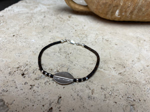 One of our signature coconut silver bracelets, crafted from polished coconut wood and hill tribe 95% silver., with sterling silver lobster clasp. A women's bracelet or a men's bracelet, it has a casual Boho vibe, and is made for that stacked bracelet look. Different sizes available