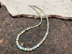 Glowing natural pastel hued graduated quartz beads teamed with sterling silver feature beads and findings
