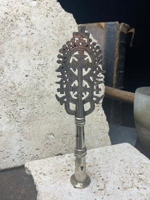 Ethiopian processional cross, hand cast by the lost wax method. Made from white metal and designed to be displayed and paraded in religious processions on top of wooden staffs, these are used vintage pieces dating to the 1970's, and are from the Lalibela region of northern Ethiopia. Height approximately 19.5 cm