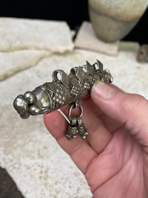 High grade, heavy silver amulet with fused ends, mid 19th century, from Afghanistan. Length 8.5 cm