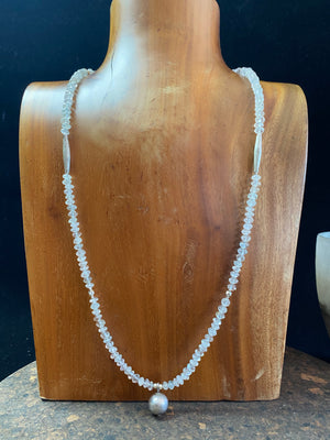 Long beaded necklace of natural, rondelle cut aquamarine beads with 95% tribal silver highlights and sterling silver findings. 74 cm length