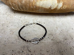 One of our signature coconut silver bracelets, crafted from polished coconut wood and hill tribe 95% silver., with sterling silver lobster clasp. A women's bracelet or a men's bracelet, it has a casual Boho vibe, and is made for that stacked bracelet look. Different sizes available