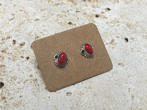 Simple and elegant, these small red coral earring studs are hand made from sterling silver and set with bamboo coral cabochons