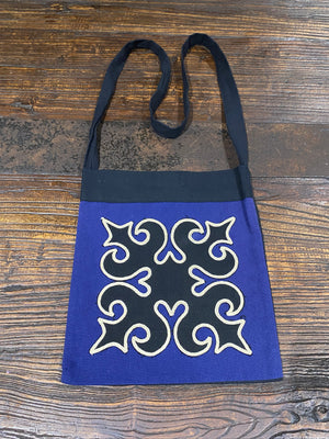 Yao hill tribe shoulder bags, stylish and practical, made from 100% cotton, with velcro tab fastening and zippered pocket inside.  Black backs and straps.  Measurements:  Height 34 x Width 25 cm  Strap height 52 cm