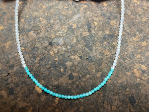 Our simple and bright choker necklace is made from rainbow moonstone and faceted amazonite beads, highlighted with sterling silver beads and a finished with a sterling silver mount and bail. Measurements: length 41 cm (16.25 in), bead diameter 2 mm