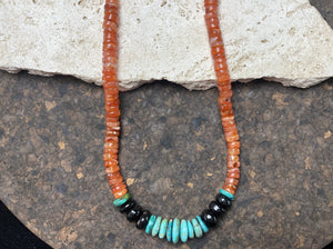 Chunky statement necklace with a southwest vibe, made from heshi cut carnelian beads, onyx and natural Arizona turquoise, finished with sterling silver beads and hook clasp. A one-off unisex necklace that will look stunning on a guy or girl. Measurements: 53 cm (21")