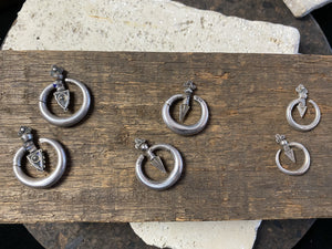 Three pairs of tribal silver earrings called Bent Arrow. Worn pushed sideways through the ear by Yao women. High grade silver, they can only be worn with an extended piercing