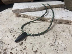Fine unisex necklace of round natural stone beads, highlighted with Karen hill tribe sterling silver "eye beads" and a long pendant of unpolished onyx. The effect is simple and stunning. Finished with sterling silver findings and hook clasp. Length 42 cm