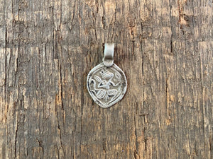 Antique silver amulets representing the Hindu god Hanuman, traditionally worn for protection and good luck. Originating in southern India, and dating from the early 19th - early 20th century. All vary between 1.4 and 1.7 cm in width