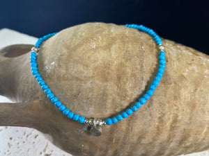Beach boho anklets featuring turquoise-look dyed howlite and sterling silver charms. Sterling silver clasps and detailing. Designed to sit gracefully around the foot rather than tight to the ankle. Select from three sizes and two styles