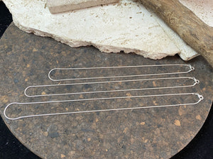 1mm diameter snake chain in three lengths. These nickel-free silver chains are German-made from 93.5% silver and are tarnish-resistant. This fine snake chain features a sturdy parrot clasp and is fitted with a narrow bail to ensure that even the smallest of pendants will fit. Select 40 cm/16", 45cm/18" or 50cm/20"