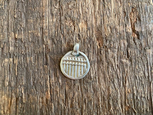 Antique silver amulets representing the Hindu god Skanda and the seven mothers, traditionally worn for protection. Early 19th - early 20th century