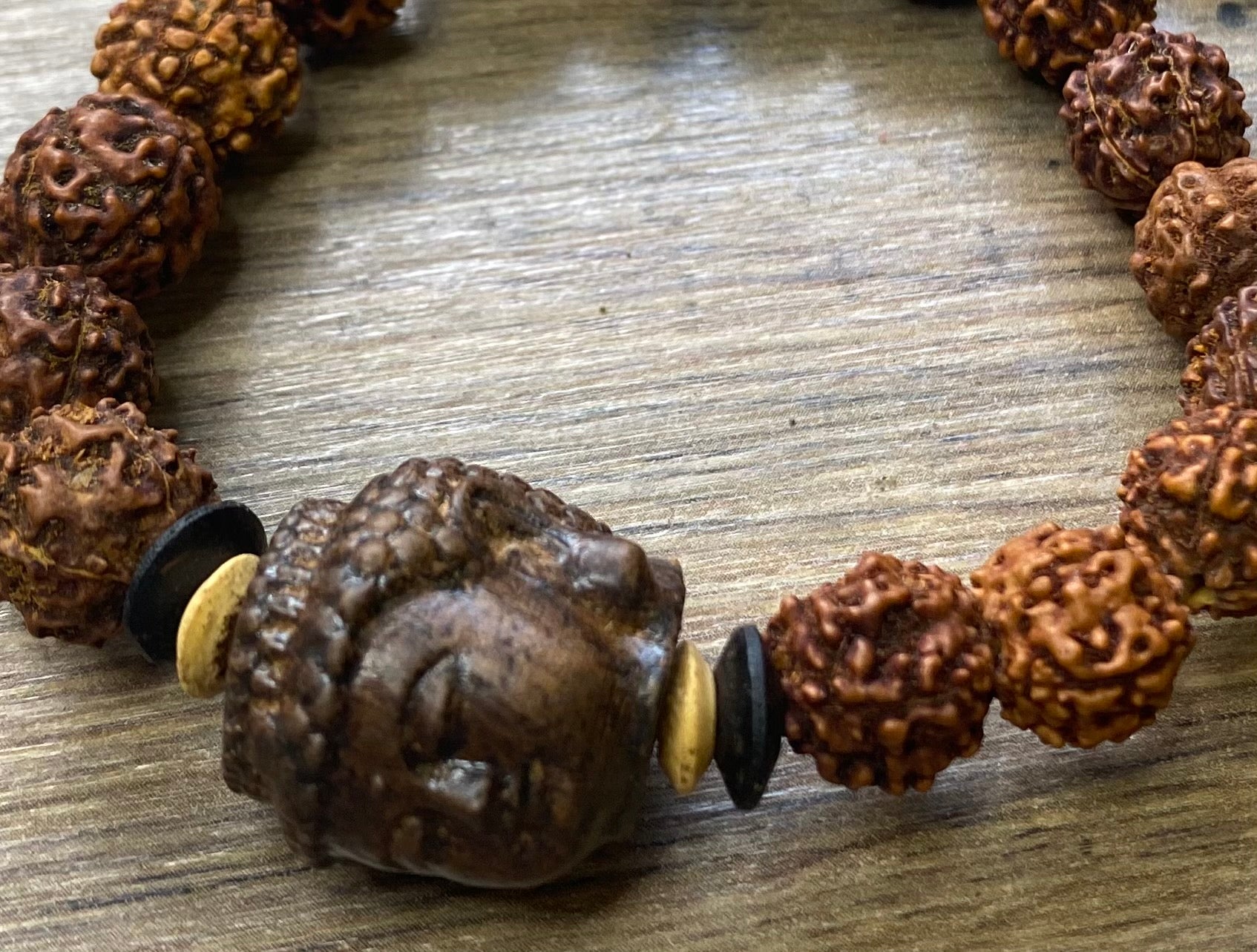 carved wood Buddha and rudraksha seed bracelet, 30 cm length