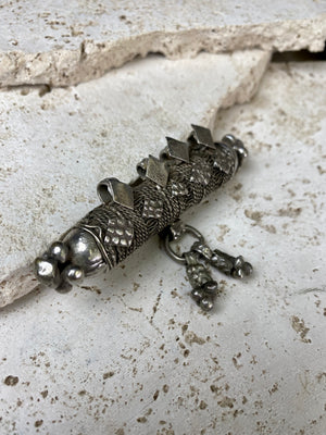 High grade, heavy silver amulet with fused ends, mid 19th century, from Afghanistan. Length 8.5 cm