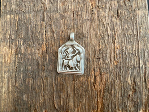 Antique silver amulets that represent Baba Ramdev (Ramdevshi), a legendary Rajput warrior who went about doing deeds of goodness and valour. These small pendants are traditionally worn for protection and good luck and date from the early 19th - early 20th century. Measurements: all vary between 1.5 and 1.7 cm in width