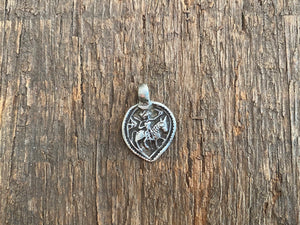 Antique silver amulets that represent Baba Ramdev (Ramdevshi), a legendary Rajput warrior who went about doing deeds of goodness and valour. These small pendants are traditionally worn for protection and good luck and date from the early 19th - early 20th century. Measurements: all vary between 1.5 and 1.7 cm in width