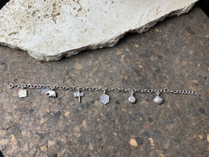 Sterling silver charm bracelet with 6 charms including elephant, dragonfly and seashell, with plenty of room to add more charms. With extension chain