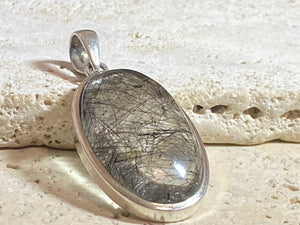 Large natural, tourmalated quartz stone pendant finished with a generous sterling silver mount and bail to emphasise its natural beauty. This is a stunning pendant that is a little out of the ordinary.
