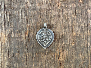 Antique silver amulets representing the Hindu god Hanuman, traditionally worn for protection and good luck. Originating in southern India, and dating from the early 19th - early 20th century. All vary between 1.4 and 1.7 cm in width