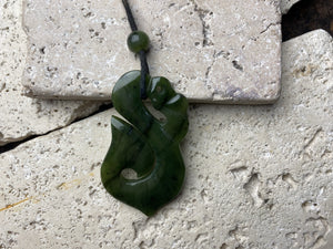 Stunning natural light green veined jade Maori guardian Manaia pendant