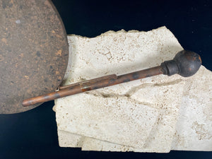 A typical village opium pipe, used by a number of hill tribe people within the Golden Triangle of southeast Asia. This is most likely Hmong.  Bamboo shaft, earthenware smoking bowl. Metal tool used to apply opium is original to the pipe. Early 20th century. In good condition with no cracks or repairs.  Total length 36 cm (14.25")