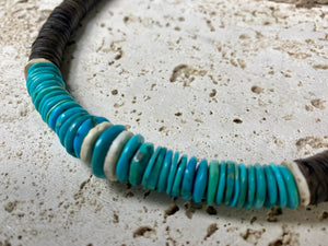 Statement necklace with an African vibe. Made from vintage wood heshi beads and Arizona turquoise, highlighted with vintage ostrich eggshell beads. The necklace is finished with handmade silver cone ends and a generous hook clasp. length 57 cm