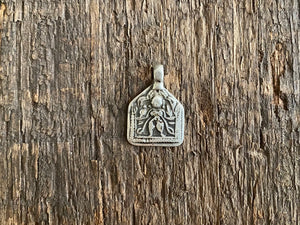 Antique silver amulets representing the Hindu god Kali, in her protective form, and dating from the early 19th - early 20th century. Measurements: all vary between 1.5 and 2.2 cm in width