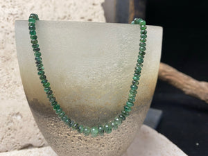 Stunning natural emerald necklace of perfectly drilled and graduated cabochon cut African emeralds finished with a sterling silver hook clasp. Not dyed or heat treated. Premium stringing on jeweller's monofilament. Length 44 cm, 52.6 Ct.