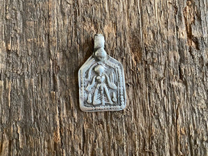 Antique silver amulets represent the Hindu goddess Kansari, goddess of the harvest and of fertility. These small pendants are traditionally worn for good luck, to increase fertility and to bring all good things to you and your home. These pendants date from the early 19th - early 20th century. Measurements: all vary between 1.4 and 1.8 cm in width