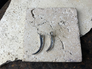 Simple sterling silver claw pendants, complete with large closed jump rings