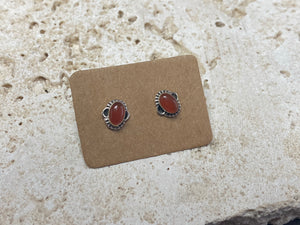 Simple and elegant, these small carnelian earring studs are hand made from sterling silver and set with natural carnelian cabochon stones