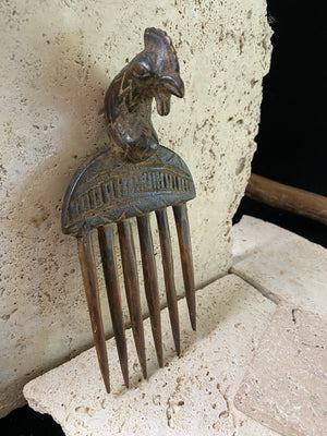 These wood box combs are used to comb the hair and for adornment. Decorative combs may be obtained as gifts or presented to them at marriage. Our combs originate in Ghana and are vintage (pre 1980). All combs have minor wood damage, irregularities and marks. Approximately 18 cm length (6.75")