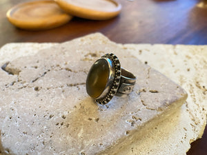 Afghan tribal ring features a large light coloured cabochon carnelian stone. The wide ring band features a stunning applied panel of work with a small crest panel for engraving. High grade silver. Late 19th century. Size 6.5